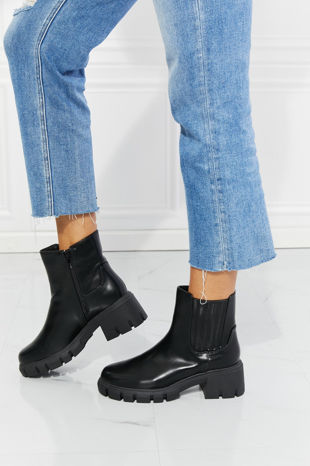 Lug Sole Chelsea Boots in Black left side